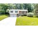 Charming two-story home with a well-maintained lawn, attached two car garage and inviting curb appeal at 5909 Ryder Ave, Charlotte, NC 28226