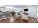 Living space featuring hardwood floors, an open layout, and abundant natural light at 5909 Ryder Ave, Charlotte, NC 28226
