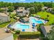 An aerial view showcasing the pool and amenities in this lush community, complete with lounge seating at 6044 Heath Valley Rd, Charlotte, NC 28210