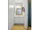 Compact bathroom featuring a vanity with mirror, light fixture, and shower with blue curtain at 6044 Heath Valley Rd, Charlotte, NC 28210