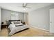Bright bedroom with carpet, neutral paint, ceiling fan, and great natural light at 6044 Heath Valley Rd, Charlotte, NC 28210