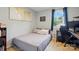 Bedroom with a cozy bed, natural light from a window, and a desk, creating a functional space at 6044 Heath Valley Rd, Charlotte, NC 28210