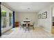 Dining area featuring a fireplace, neutral walls, and access to the backyard at 6044 Heath Valley Rd, Charlotte, NC 28210