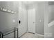 Inviting entryway featuring neutral tones, coat hooks, and tiled flooring at 6044 Heath Valley Rd, Charlotte, NC 28210