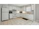 Bright kitchen featuring tiled floors, ample cabinets and modern appliances at 6044 Heath Valley Rd, Charlotte, NC 28210