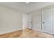Cozy bedroom boasts ample natural light, modern trim, and durable wood-look flooring at 707 W Davidson Ave, Gastonia, NC 28052