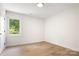 Cozy bedroom boasts ample natural light, modern trim, and durable wood-look flooring at 707 W Davidson Ave, Gastonia, NC 28052