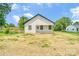An inviting, modern home with white siding and a covered front porch sits on a grassy lot at 707 W Davidson Ave, Gastonia, NC 28052