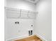 Laundry room with hookups and wire shelving at 707 W Davidson Ave, Gastonia, NC 28052