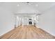 Open concept living space boasts modern flooring, vaulted ceiling, and white shaker cabinets at 707 W Davidson Ave, Gastonia, NC 28052