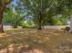 Spacious backyard with mature trees and ample room for recreation; privacy fence included at 713 Springfield Nw Dr, Concord, NC 28027