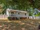 The large backyard features a white privacy fence and a well-maintained lawn with a covered back porch at 713 Springfield Nw Dr, Concord, NC 28027