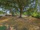 Large backyard showcasing mature trees and privacy fencing, perfect for outdoor activities and entertaining at 713 Springfield Nw Dr, Concord, NC 28027