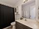 Functional bathroom with a shower, modern vanity, and storage shelves at 713 Springfield Nw Dr, Concord, NC 28027