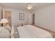 Inviting bedroom with an ensuite bathroom, a comfortable bed, and neutral color scheme at 713 Springfield Nw Dr, Concord, NC 28027