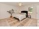 Cozy bedroom featuring neutral tones, a decorative rug, and a ceiling fan for added comfort at 713 Springfield Nw Dr, Concord, NC 28027