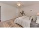 Well-lit bedroom showcasing neutral tones, carpet floors, and a view to the backyard at 713 Springfield Nw Dr, Concord, NC 28027