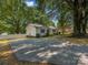 Charming home with a driveway and surrounded by mature trees, offering a welcoming curb appeal at 713 Springfield Nw Dr, Concord, NC 28027