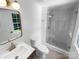 Bright bathroom featuring a glass shower, updated vanity, and modern fixtures at 7134 Rollingridge Dr, Charlotte, NC 28211