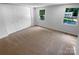 Bedroom with carpet, closet and dual windows allowing plenty of natural light at 7134 Rollingridge Dr, Charlotte, NC 28211