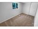 Bedroom featuring neutral carpet and a side view window at 7134 Rollingridge Dr, Charlotte, NC 28211