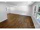 Bright living room with hardwood floors and natural light from large windows at 7134 Rollingridge Dr, Charlotte, NC 28211