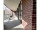 Exterior brick balcony with seating area overlooking the community at 720 Governor Morrison St # 221, Charlotte, NC 28211