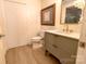 Bathroom featuring modern vanity, stylish mirror, and tile floors at 720 Governor Morrison St # 221, Charlotte, NC 28211
