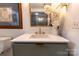 Bathroom featuring modern vanity, stylish mirror, and neutral color palette at 720 Governor Morrison St # 221, Charlotte, NC 28211