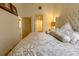 Bedroom view highlighting plush bedding, modern lighting, and a glimpse into the ensuite bathroom at 720 Governor Morrison St # 221, Charlotte, NC 28211