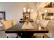 Bright dining area with modern lighting and an ornate mirror complements the adjacent contemporary kitchen at 720 Governor Morrison St # 221, Charlotte, NC 28211