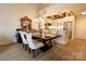 Dining area adjacent to the kitchen featuring elegant furniture, and modern lighting at 720 Governor Morrison St # 221, Charlotte, NC 28211