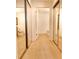 Bright hallway leading to bathrooms, enhanced by mirrored closet doors that amplify the natural light at 720 Governor Morrison St # 221, Charlotte, NC 28211