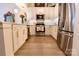Bright kitchen featuring stainless steel appliances, white cabinetry, and ample counter space at 720 Governor Morrison St # 221, Charlotte, NC 28211
