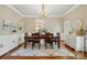 Traditional dining room with chandelier, wood table set, and white buffet, perfect for Gathering gatherings at 748 Land Fall Dr, Rock Hill, SC 29732