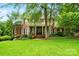 Stately brick home with lush green lawn and mature landscaping, offering timeless elegance at 748 Land Fall Dr, Rock Hill, SC 29732