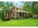 Charming brick residence featuring a welcoming front porch and well-manicured garden, radiating curb appeal at 748 Land Fall Dr, Rock Hill, SC 29732