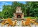 Picturesque outdoor fireplace on a stone patio, surrounded by seating at 748 Land Fall Dr, Rock Hill, SC 29732