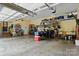 Spacious garage with ample storage, featuring a golf cart and well-organized shelves at 748 Land Fall Dr, Rock Hill, SC 29732