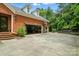 Brick home showcasing a 2-car garage with basketball hoop, ample parking, and landscaped surroundings at 748 Land Fall Dr, Rock Hill, SC 29732
