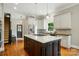 Bright kitchen featuring a spacious island with a cooktop, stainless steel appliances, and wood floors at 748 Land Fall Dr, Rock Hill, SC 29732