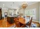 Open-concept kitchen and dining area with a large island and a chandelier, great for entertaining at 748 Land Fall Dr, Rock Hill, SC 29732