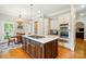 Gourmet kitchen with a large island, stainless steel appliances, and hardwood floors, perfect for cooking at 748 Land Fall Dr, Rock Hill, SC 29732