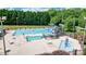Community pool with water slides, splash pad, lounge chairs, and shaded seating areas at 748 Land Fall Dr, Rock Hill, SC 29732