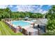 Community pool area with a slide, area, lounge chairs, and shaded seating at 748 Land Fall Dr, Rock Hill, SC 29732