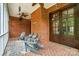 Charming covered porch with brick flooring and cozy seating area at 748 Land Fall Dr, Rock Hill, SC 29732