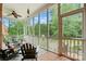 Relaxing screened-in porch with comfortable seating and wooded views at 748 Land Fall Dr, Rock Hill, SC 29732