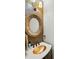 A stylish powder room features a decorative mirror and a unique copper vessel sink at 748 Land Fall Dr, Rock Hill, SC 29732