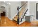 Stairway with carpet runner, wooden floors, and coat storage at 748 Land Fall Dr, Rock Hill, SC 29732
