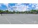 Outdoor tennis court featuring a well-maintained surface and a surrounding green landscape at 748 Land Fall Dr, Rock Hill, SC 29732